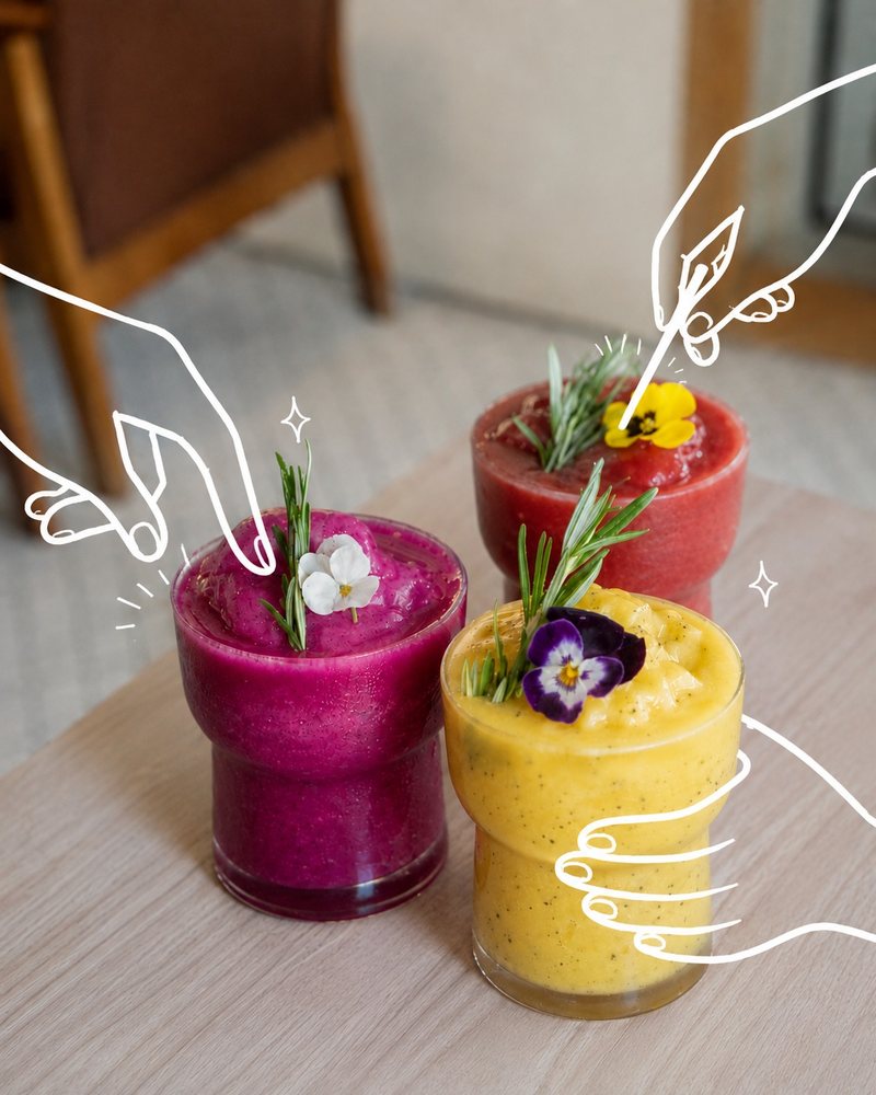 Three ice-blended fruit drinks in glasses